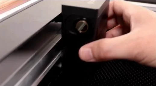 You should be able to slide the printhead back