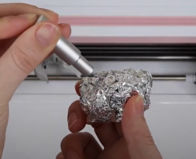 Roll up a ball of aluminum foil