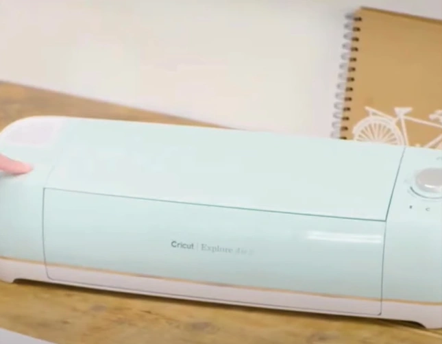 Start by inserting the power cable into the Cricut Explore Air 2