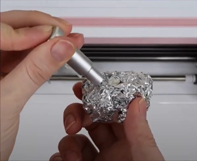 Roll up a ball of aluminum foil