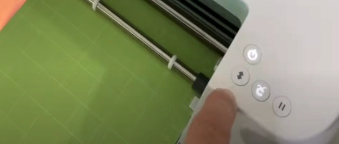 unload the mat by pressing the arrow button.