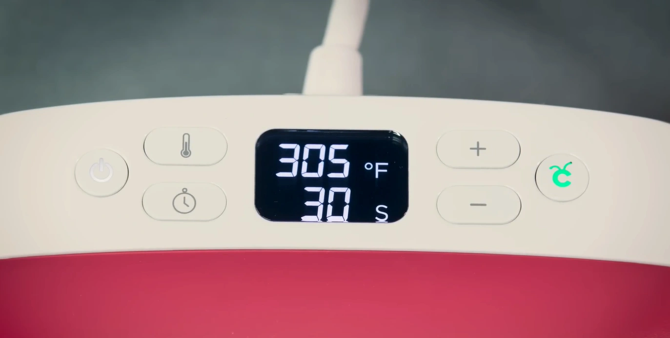 When you hear the beep sound and the button turns green