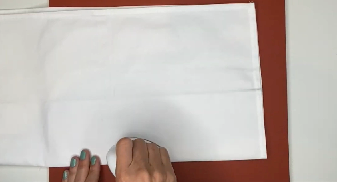 or a folded towel underneath if working with curved items like a hat or shoes