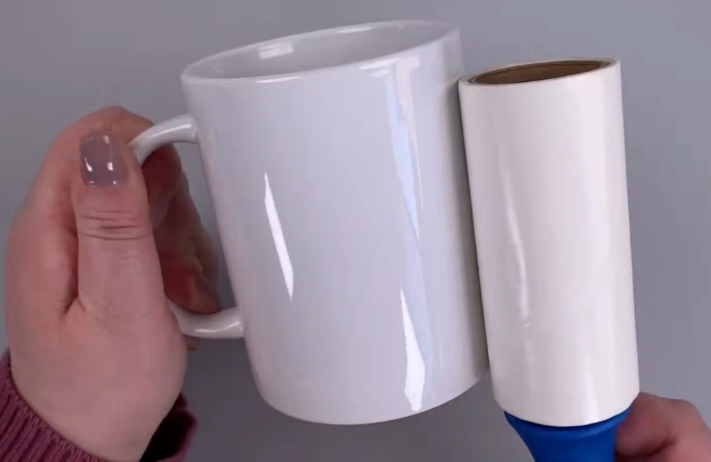 Run a lint roller on the mug to clean it
